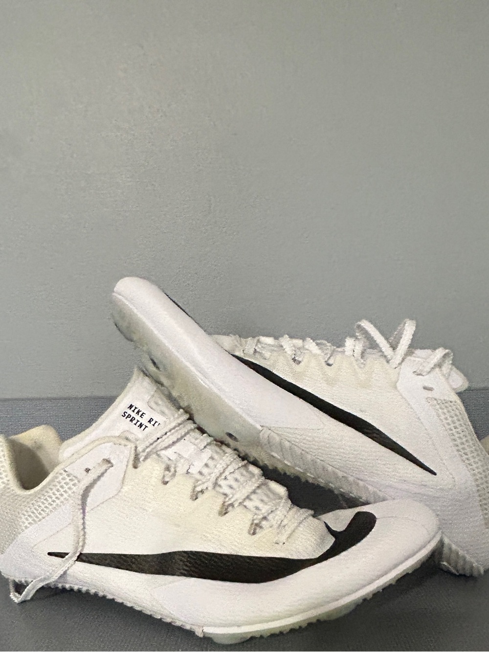 Nike Men’s White Athletic Track Spikes with Black Swoosh